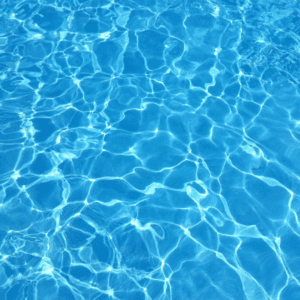 A pool with blue water and ripples on it.