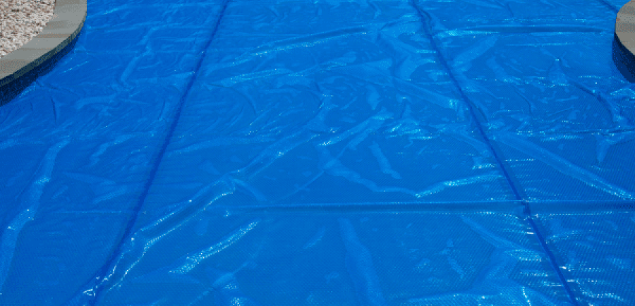 A pool cover is being used to protect the swimming area. in florida