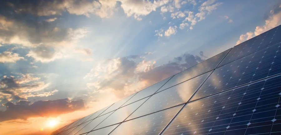 A close up of some solar panels on the side of a building